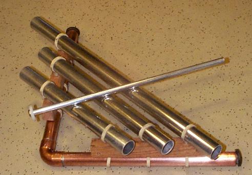 A three-note dinner chime, built of aluminium and copper tubing.