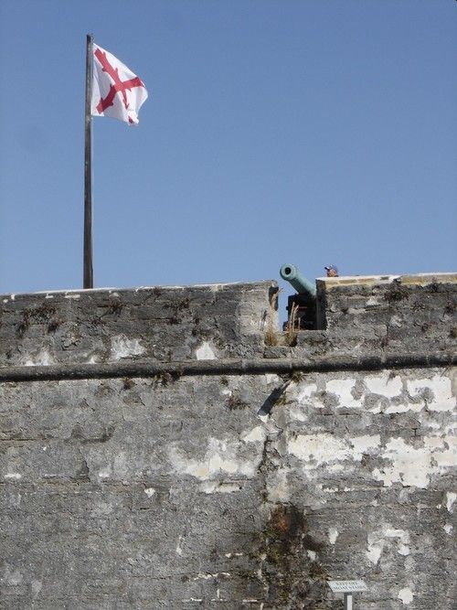 A flag and gun on Castillo de San Marco in St Augustine, Florida