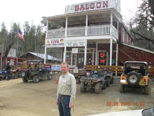 Niel Malan posing in front of the Saloon in Crowned King, AZ